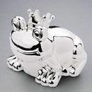 Silver frog figurine with a crown on a white background