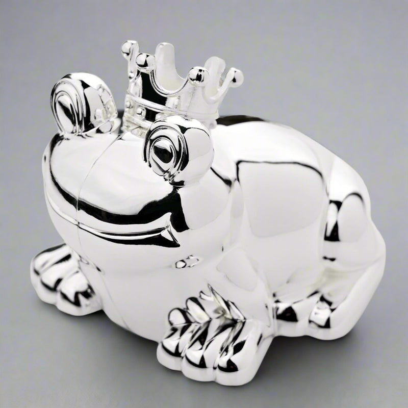 Silver frog figurine with a crown on a white background