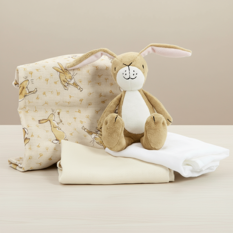 Plush rabbit toy and blanket with rabbit pattern on a white background