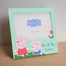 Peppa Pig photo frame with two cartoon pigs and text on a white background