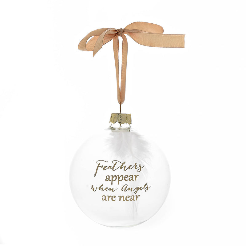 A Christmas bauble with a feather inside and the words 'Feathers Appear When Angels Are Near' on the front
